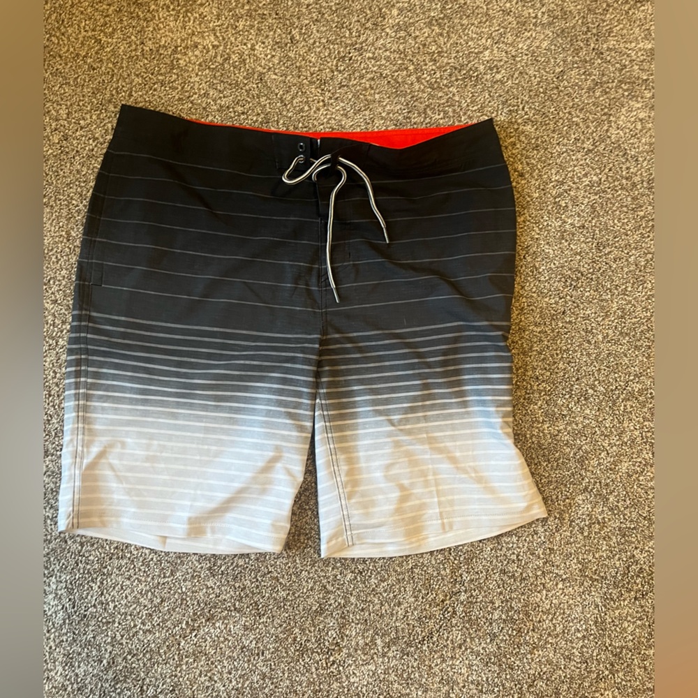Men’s size 40, swim board shorts. Never worn, new without tags.